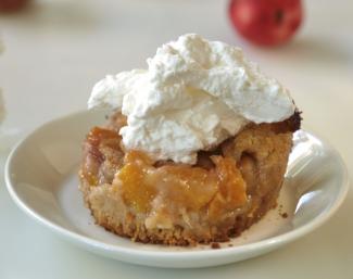 Peach cobbler with whipped cream